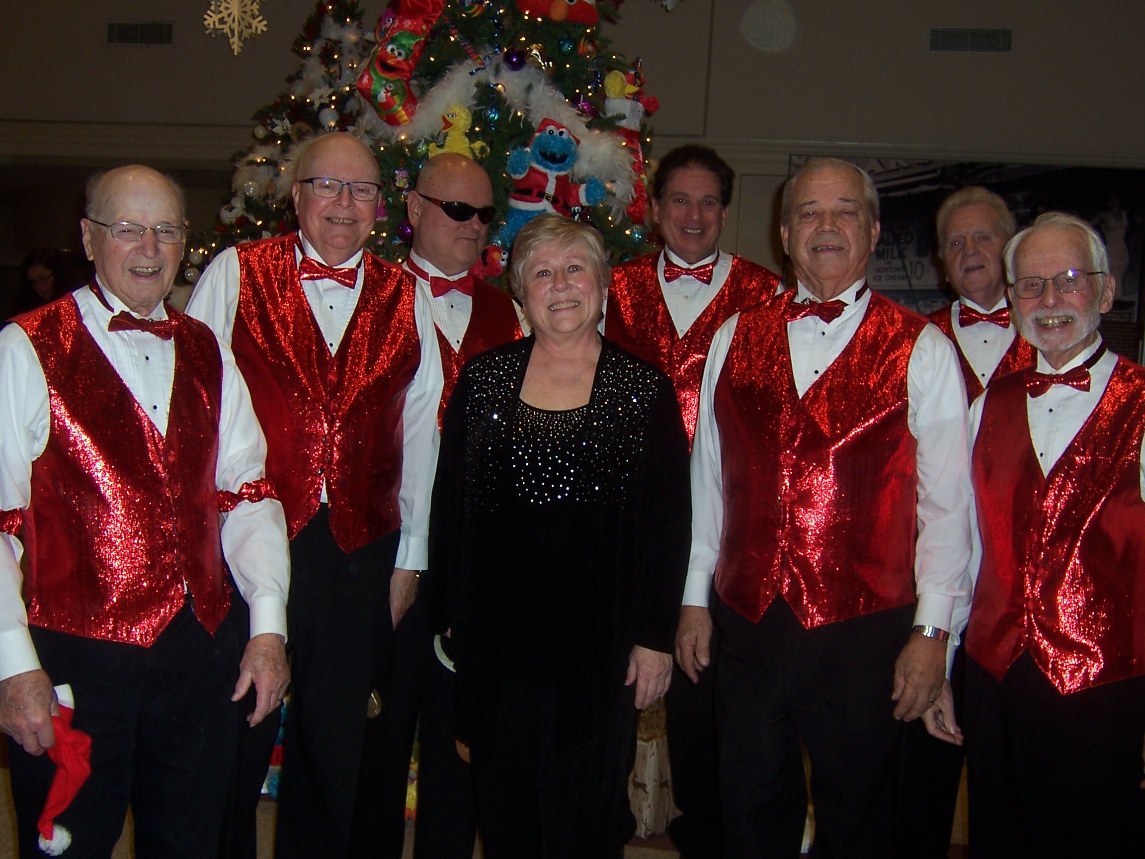 Group photo of the chorus, onstage, in festive attire (2 of 2)